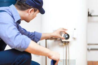 logan plumber professional checking water heater