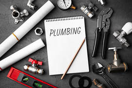 logan plumbing picture with plumber tools